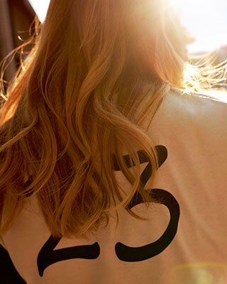 The image shows a rear view of the Boxer shirt for women.